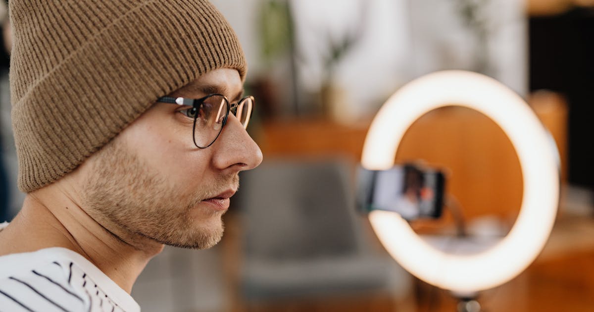 YouTube content creator recording video with professional microphone and lighting
